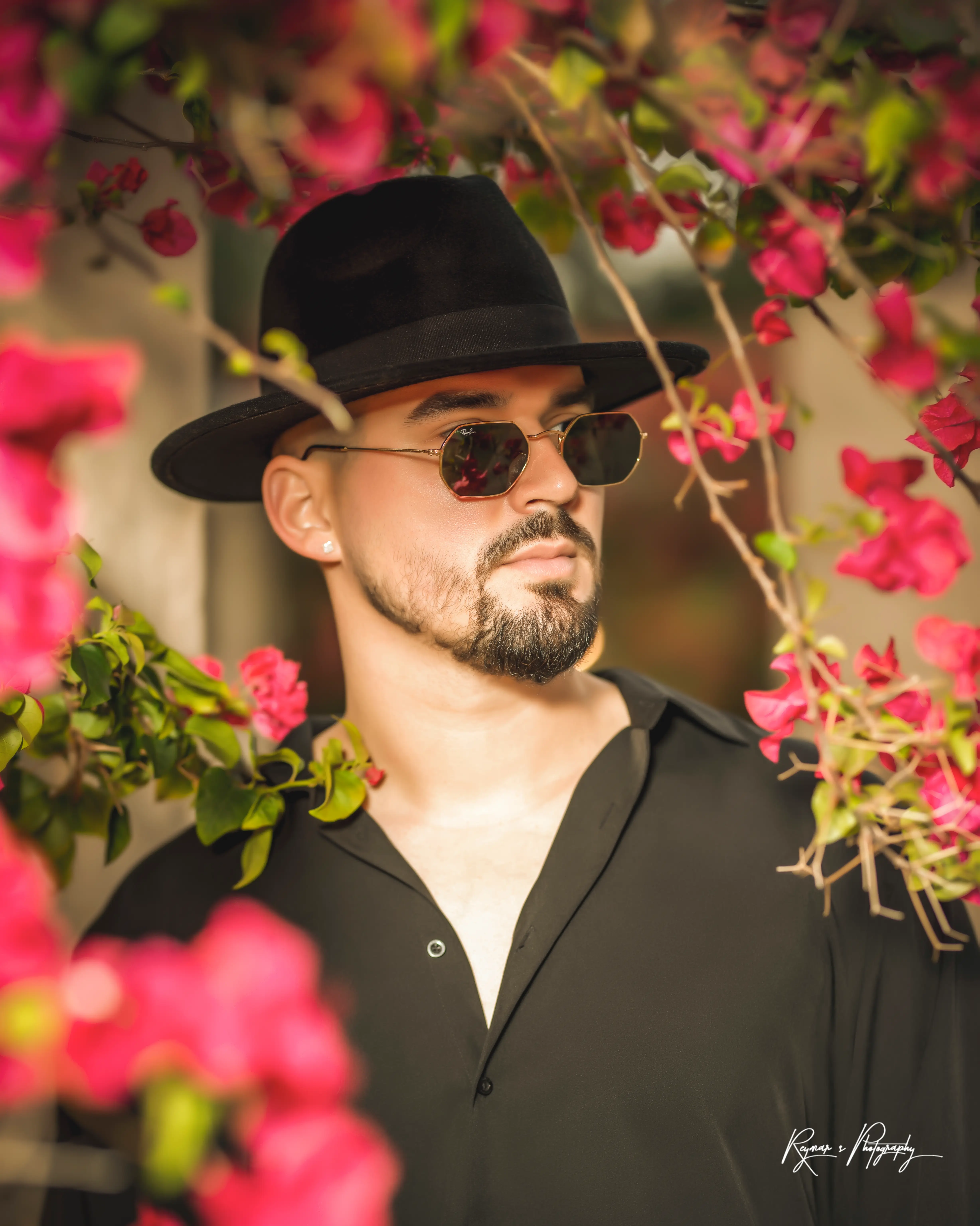 Lazaro with red flowers looking right