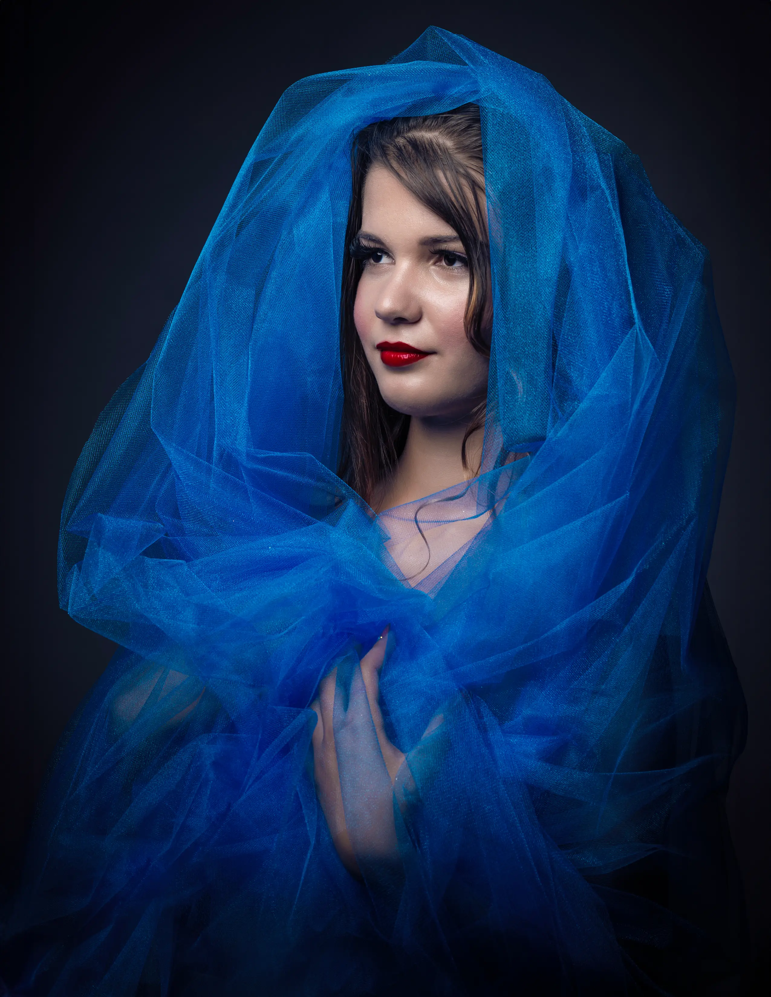 Marinalva blue outfit looking left