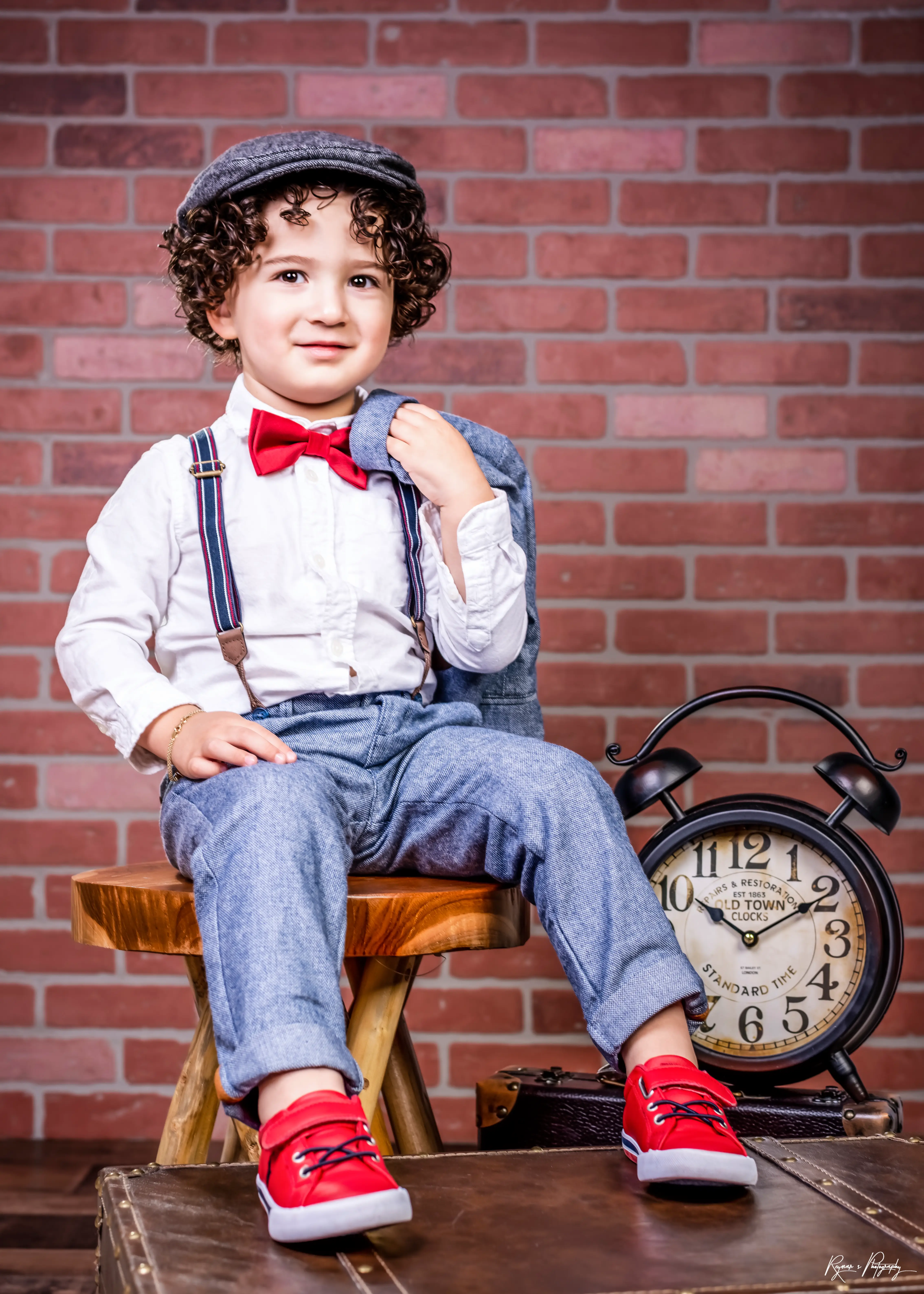 Boy with clock on the left